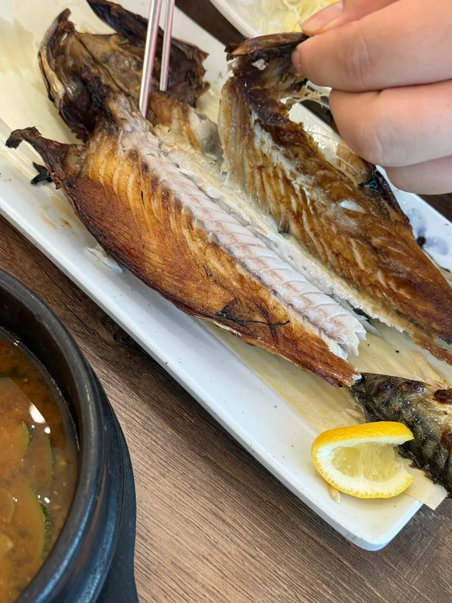 A whole golden-brown grilled mackerel