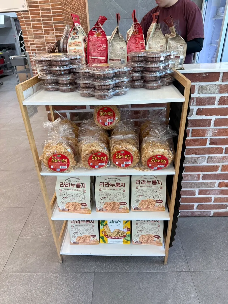 Scorched rice and snacks displayed by the register