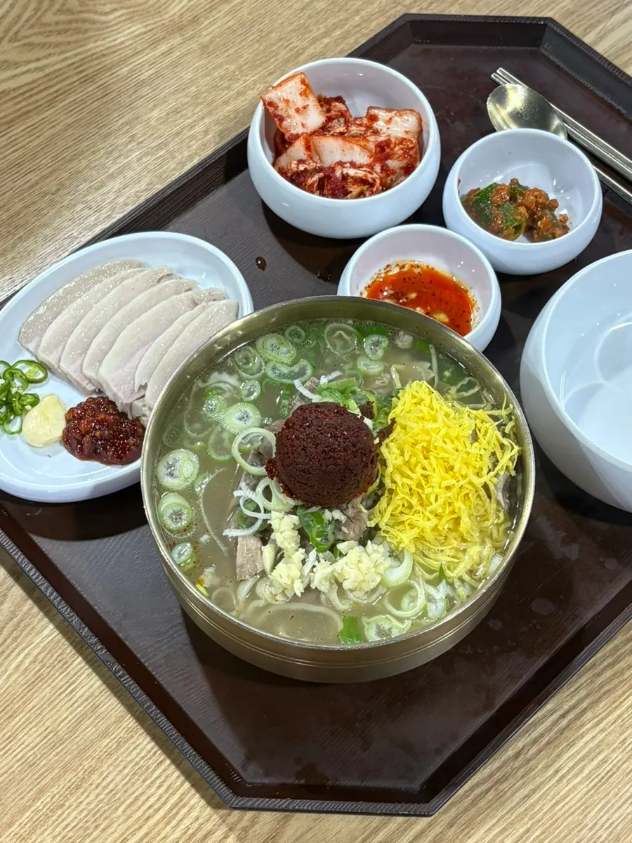 Close-up of the spicy bone kalguksu broth and bone meat