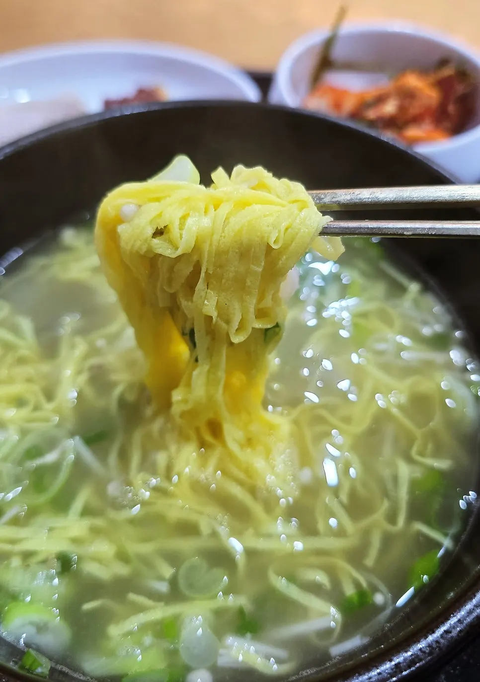 Egg garnish and glass noodles left after removing the bones