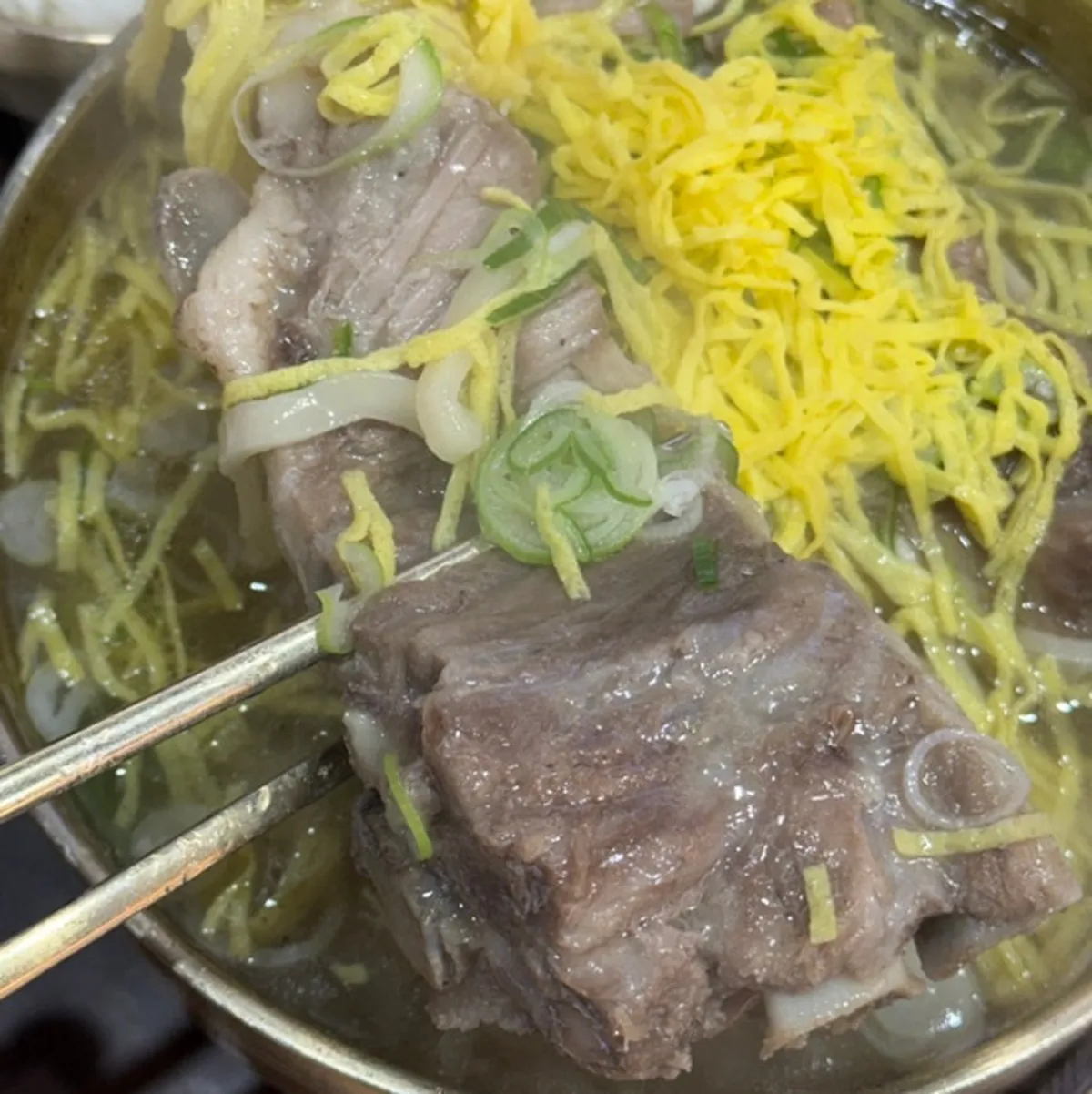 Pyeongi Dambaek bone kalguksu with a large bone inside
