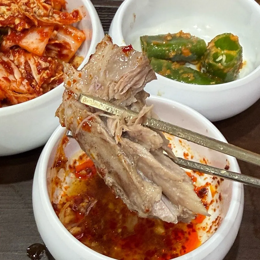 Bowl of bone kalguksu after the meat has been picked off the bones