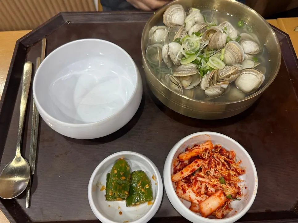 Clam kalguksu piled high with clams