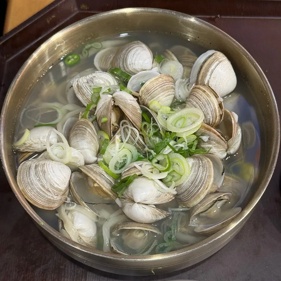 Clam kalguksu with clams covering the noodles