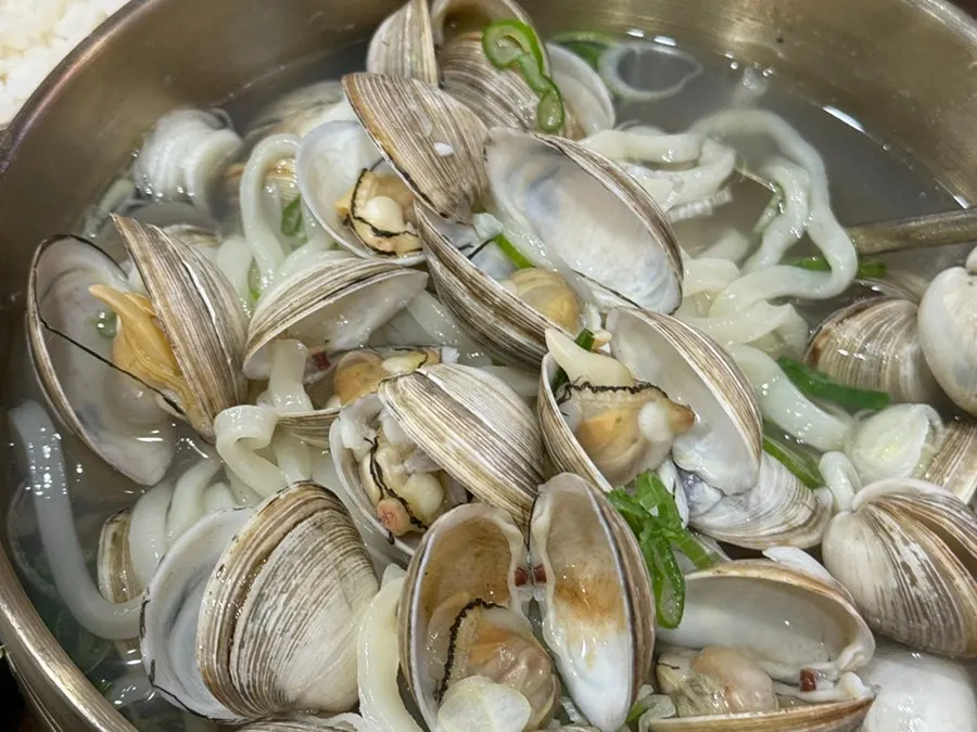Table view of clams being shelled