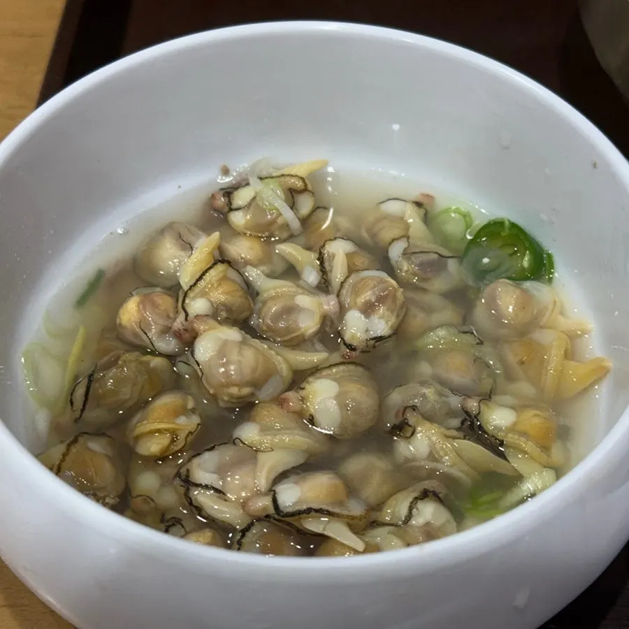 A bowl piled high with empty clam shells