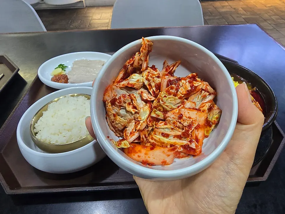 Kimchi salad and cucumber peppers tossed in ssamjang side dishes