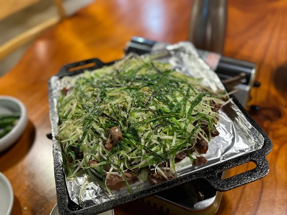 Charcoal pajeon bulgogi warming at the table