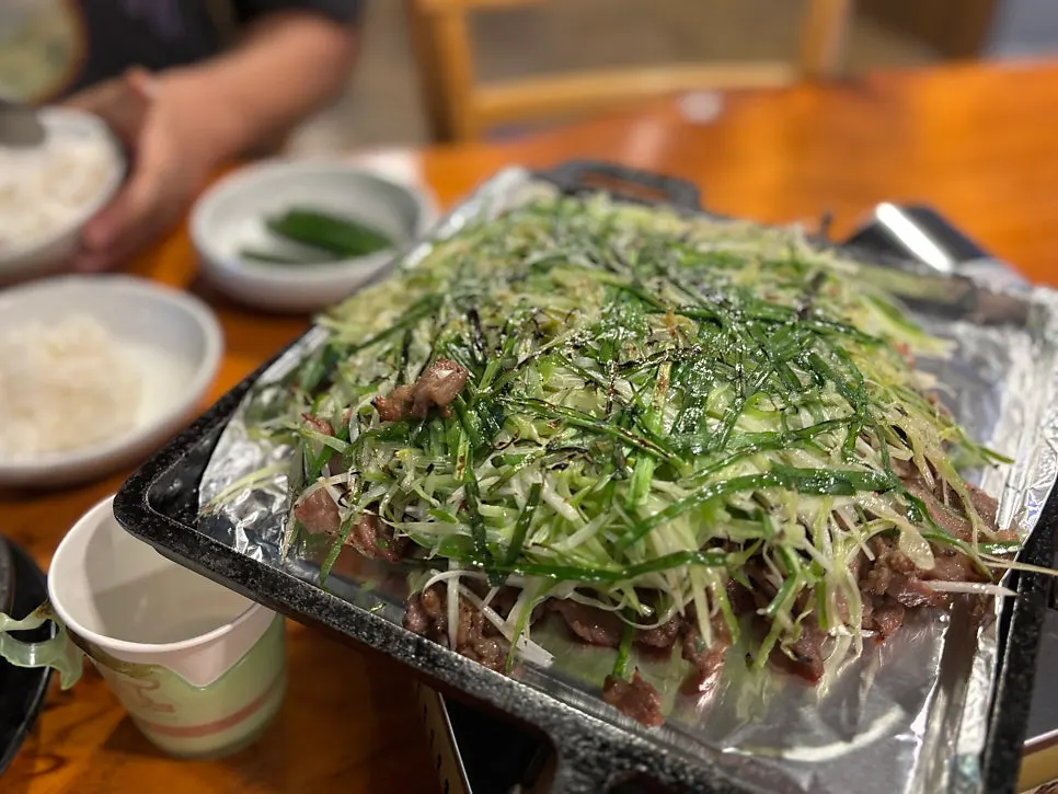 Charcoal pajeon bulgogi on an iron griddle