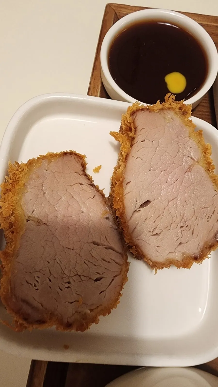 Two pieces of sirloin katsu on a small plate