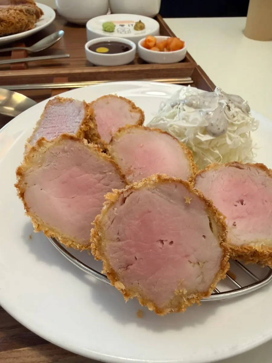 Tenderloin katsu with a faint pink cross-section