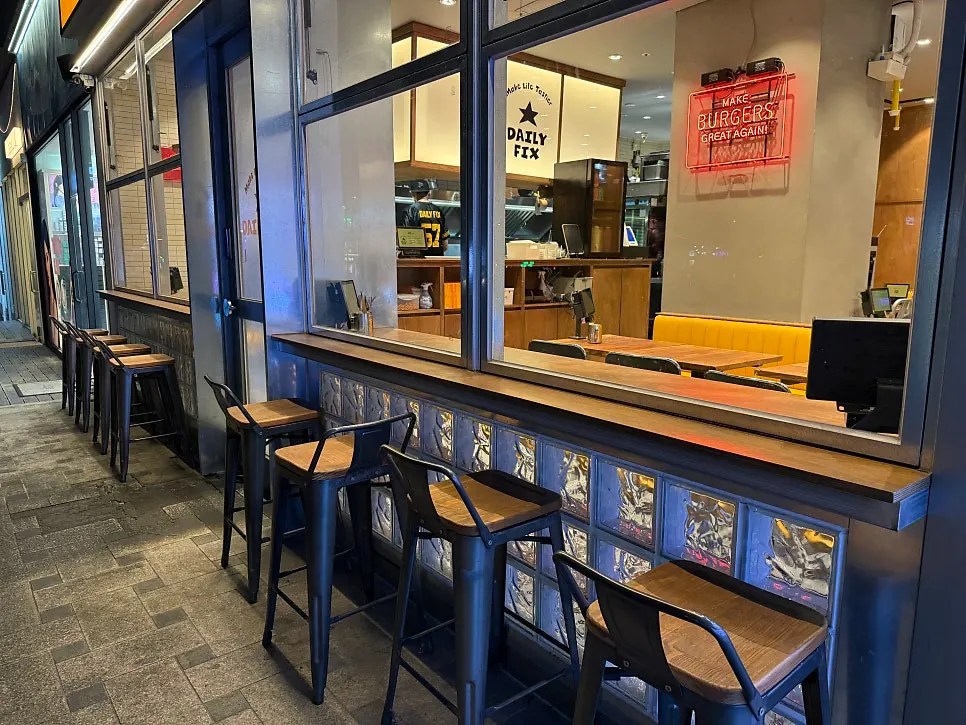 Dining area with window-side bar tables