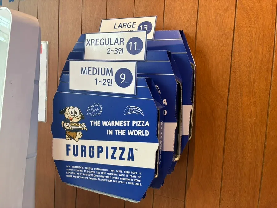 A whole half-and-half pizza on the table