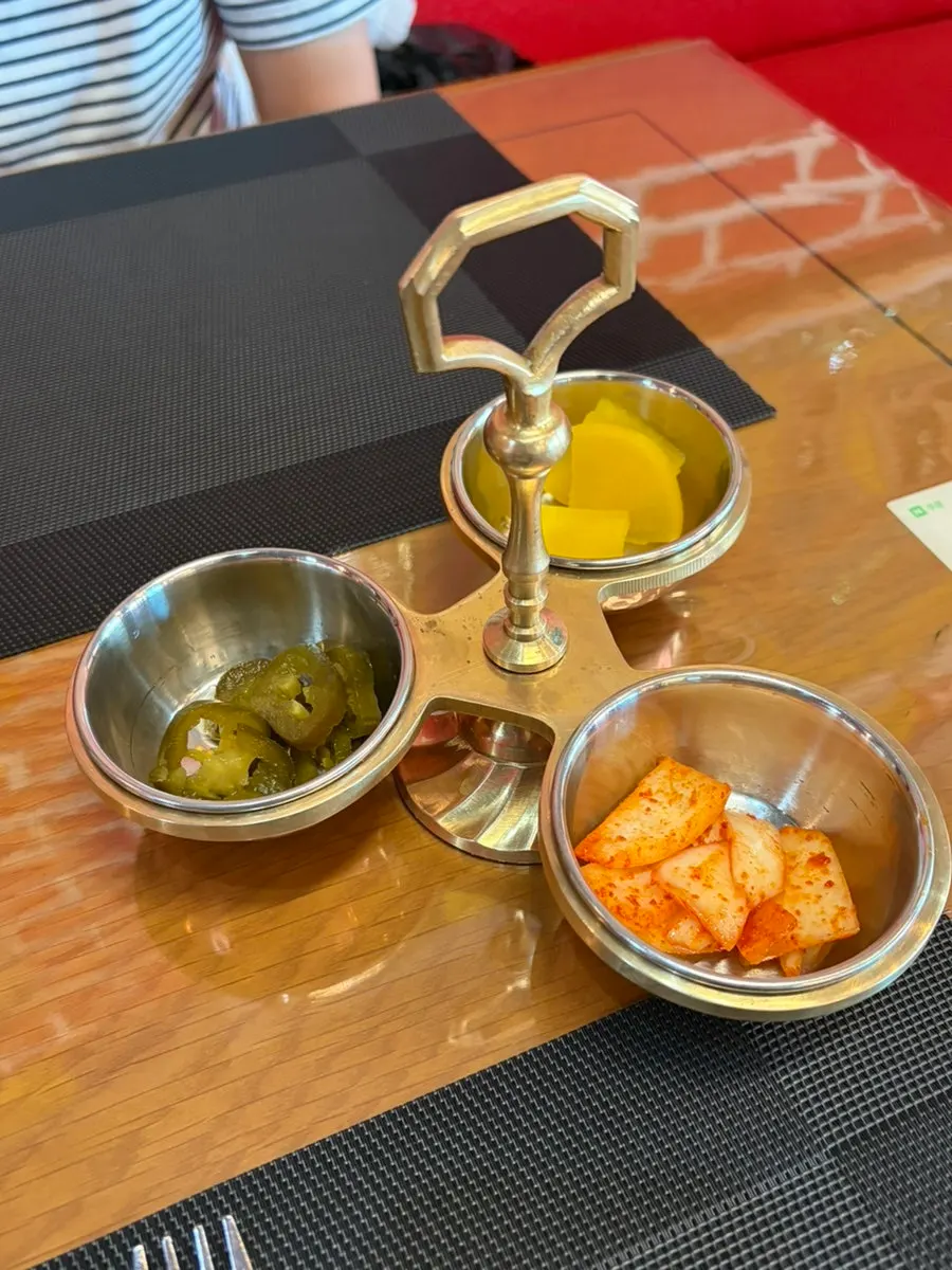 Jalapeño, danmuji, and kimchi side dishes