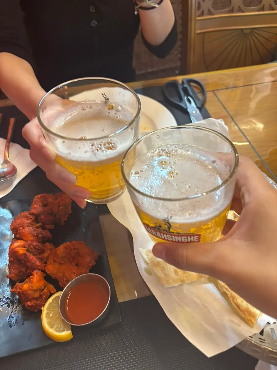 Table with lassi and Kingfisher beer