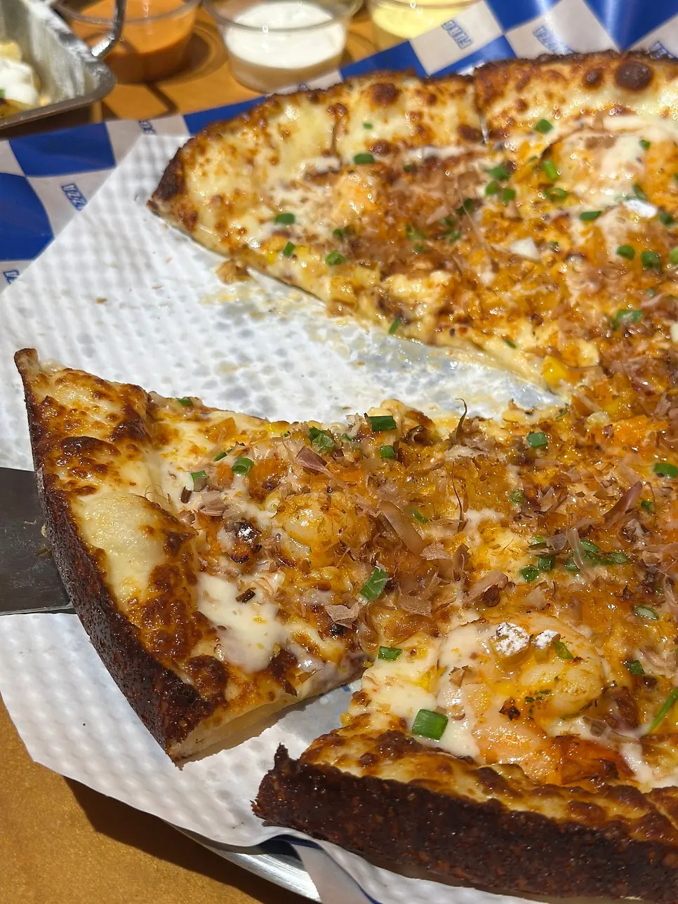 Seafood pizza topped with katsuobushi