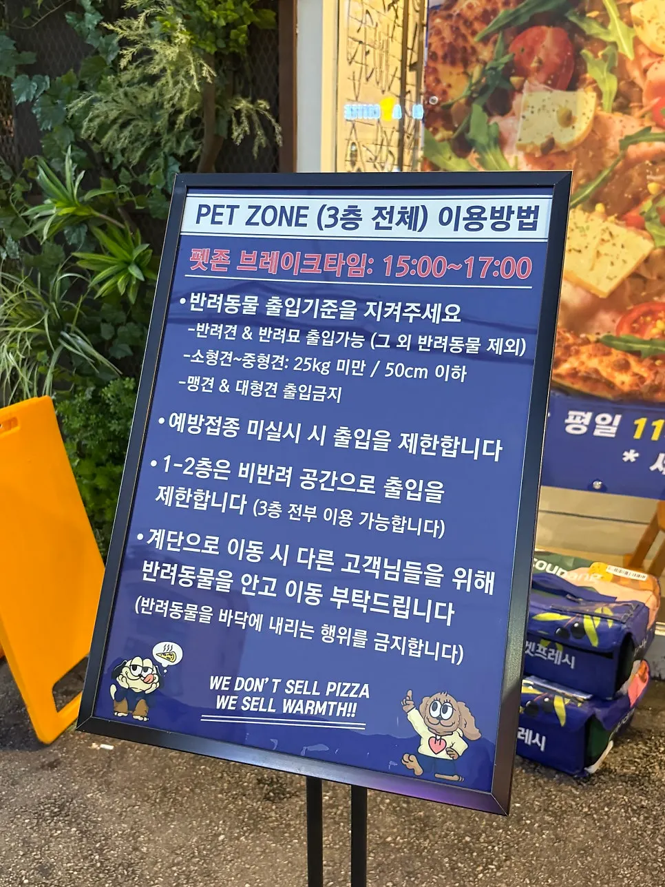Pug character photo zone eating pizza