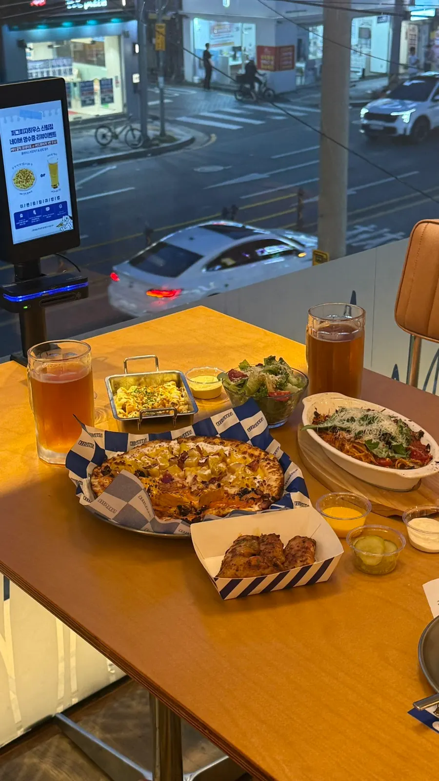 Large menu board in front of the restaurant