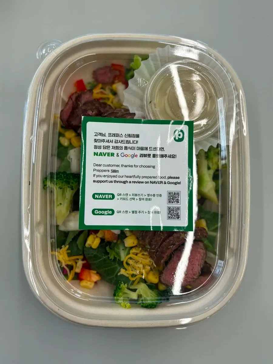 Salad pasta topped with beef