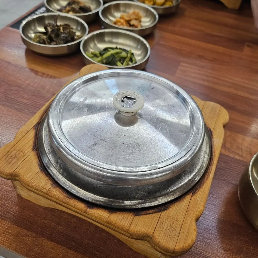 A bite of wrap topped with pork bulgogi
