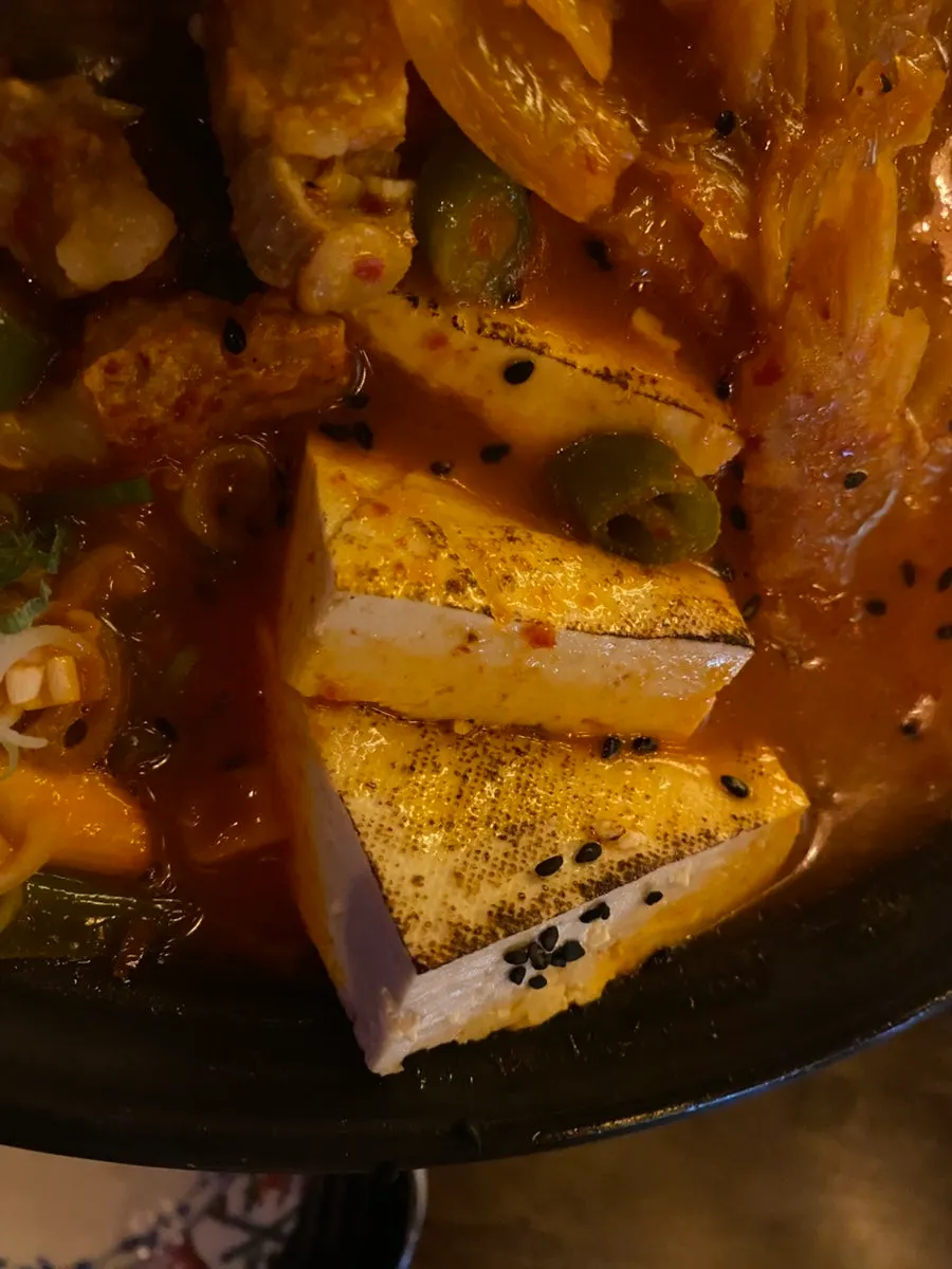 A full row of tofu packed into the hot pot