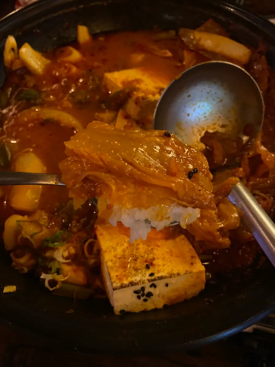 Warm white rice served alongside the hot pot