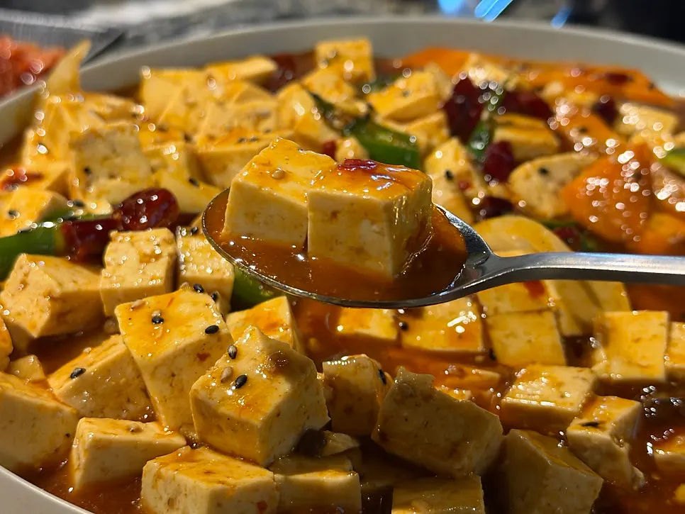 Mapo tofu and guobaorou laid out on the table