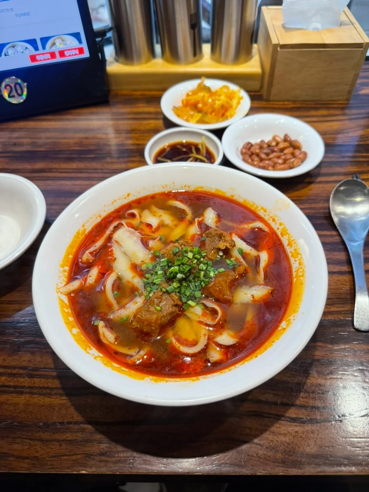 A bowl of beef knife-cut noodles at Sinbok Myeongwan Gangnam