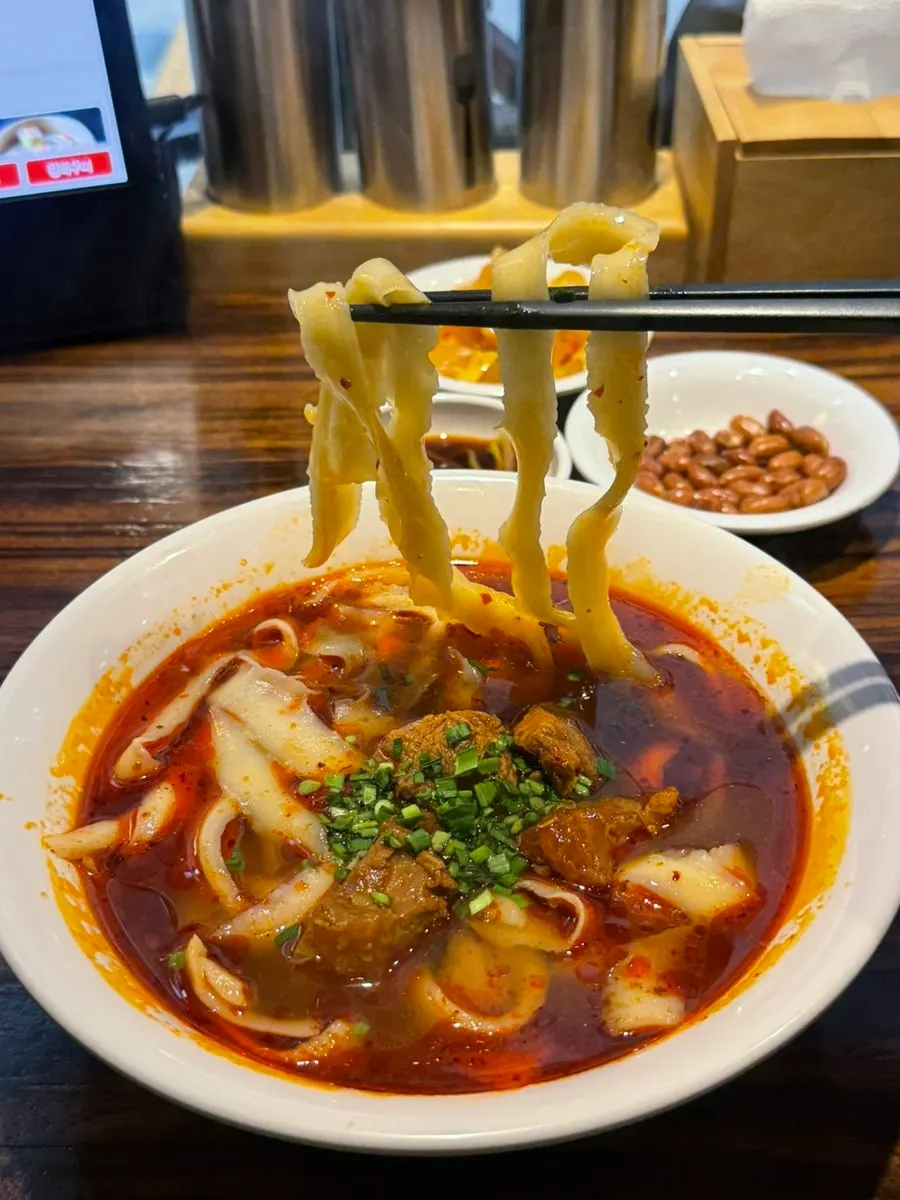 Thick hand-pulled knife-cut noodle strands