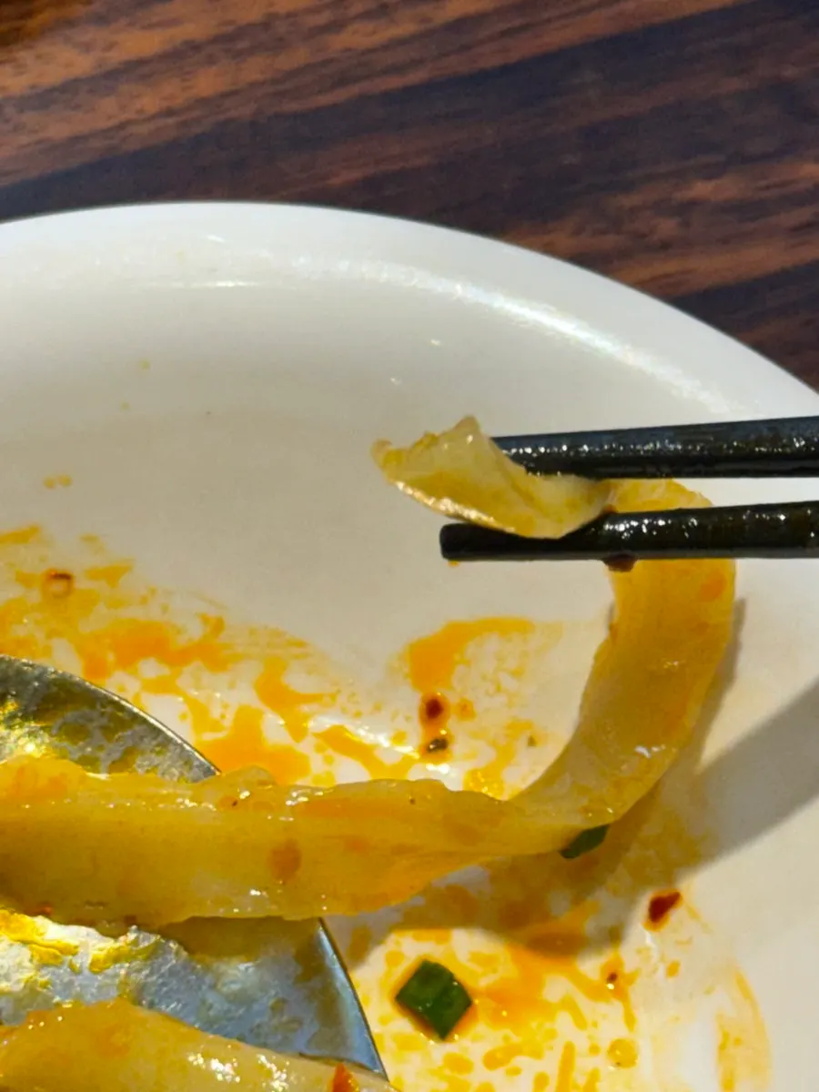Picking up perfectly cooked thick knife-cut noodles