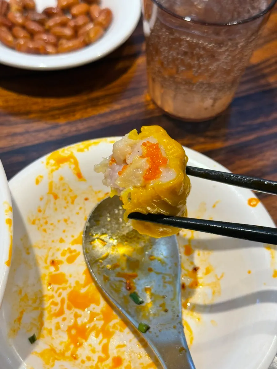 A bitten shumai showing its cross-section