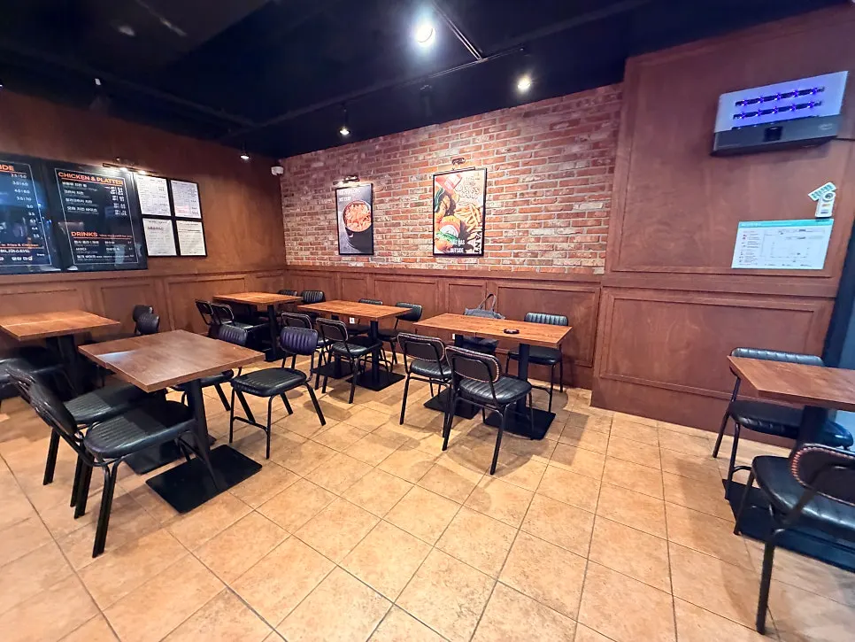 Bas Burger's interior with neon signs and cozy lighting