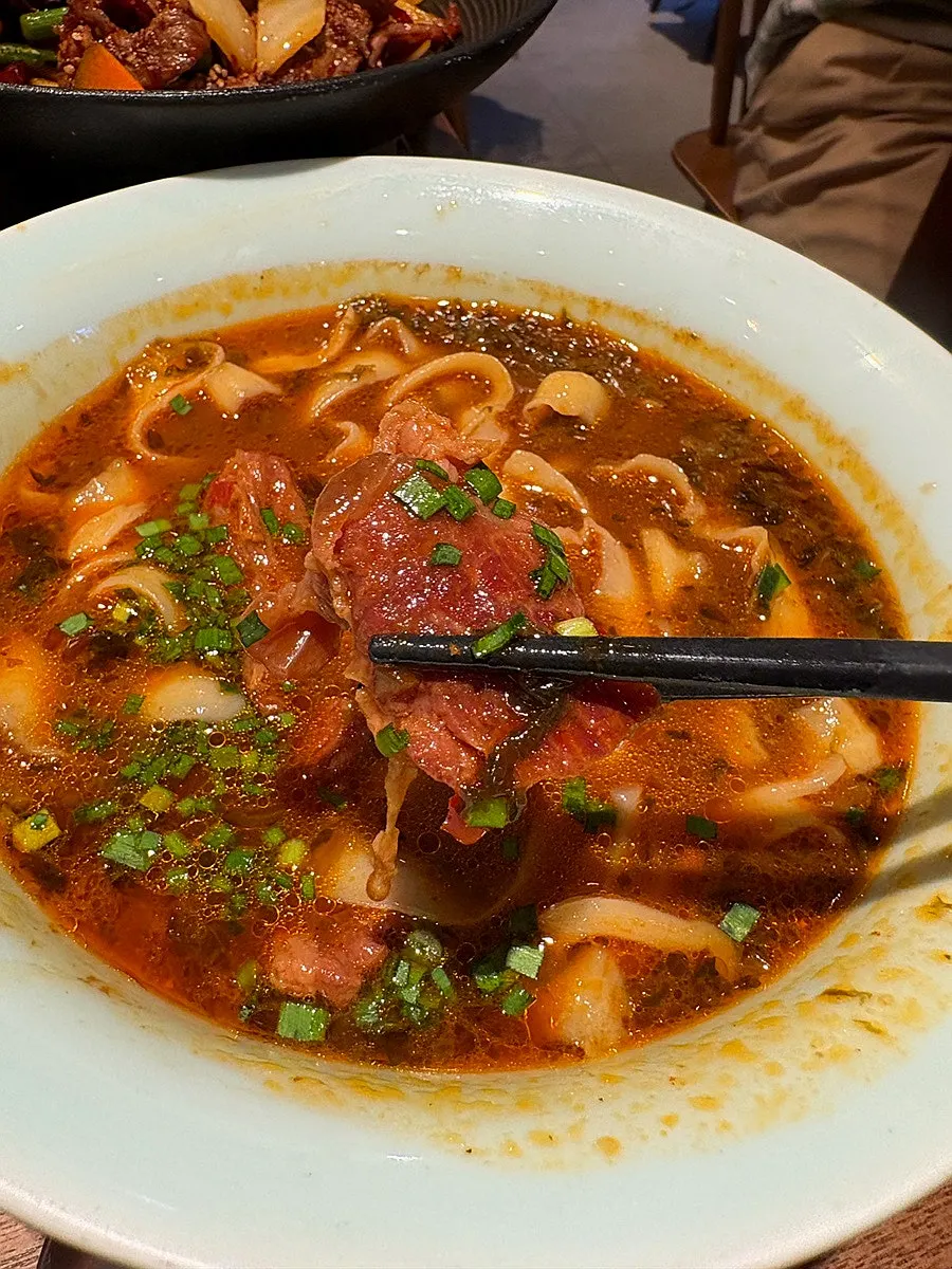 A bowl of Cheonghwaweon's signature beef daosakmyeon
