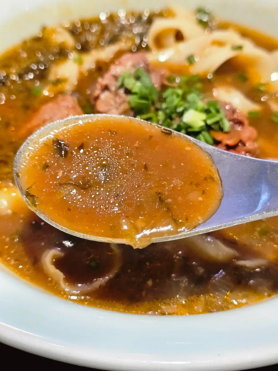 Beef dao xiao mian topped with beef in bone broth