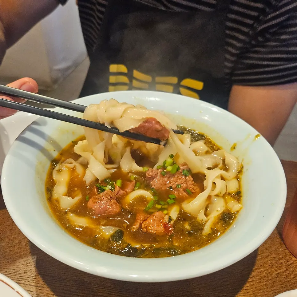 A bowl of beef knife-cut noodles in broth