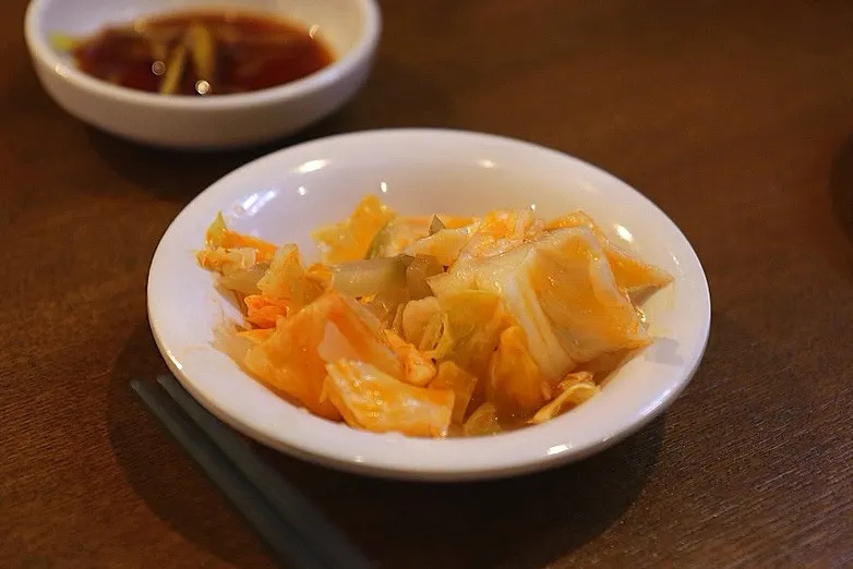 Basic table setting of roasted peanuts and Taiwanese-style cabbage kimchi