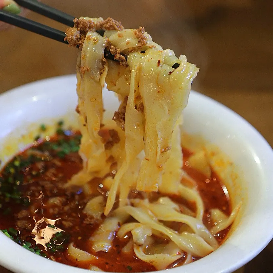 Close-up of wide, chewy handmade knife-cut noodles