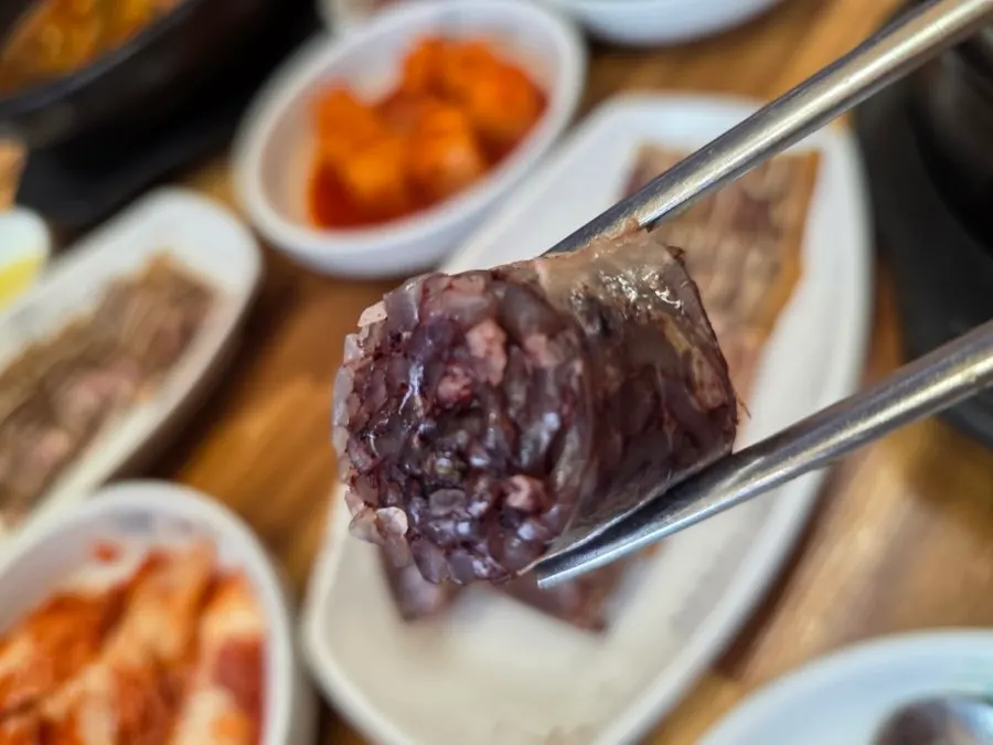 Dipping sundae into salted shrimp sauce