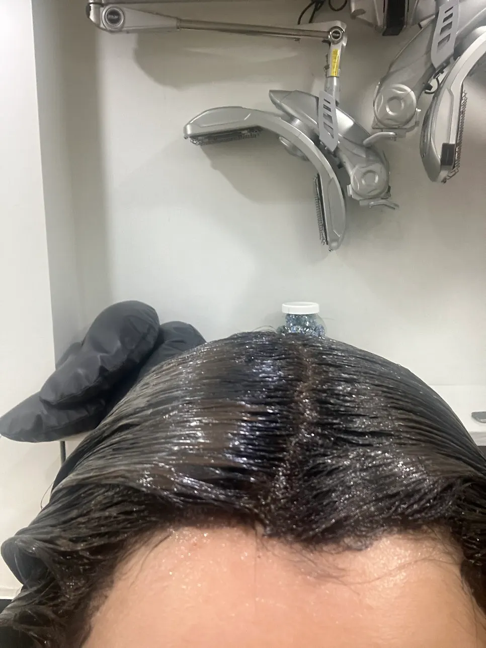 Black dye being applied during the treatment