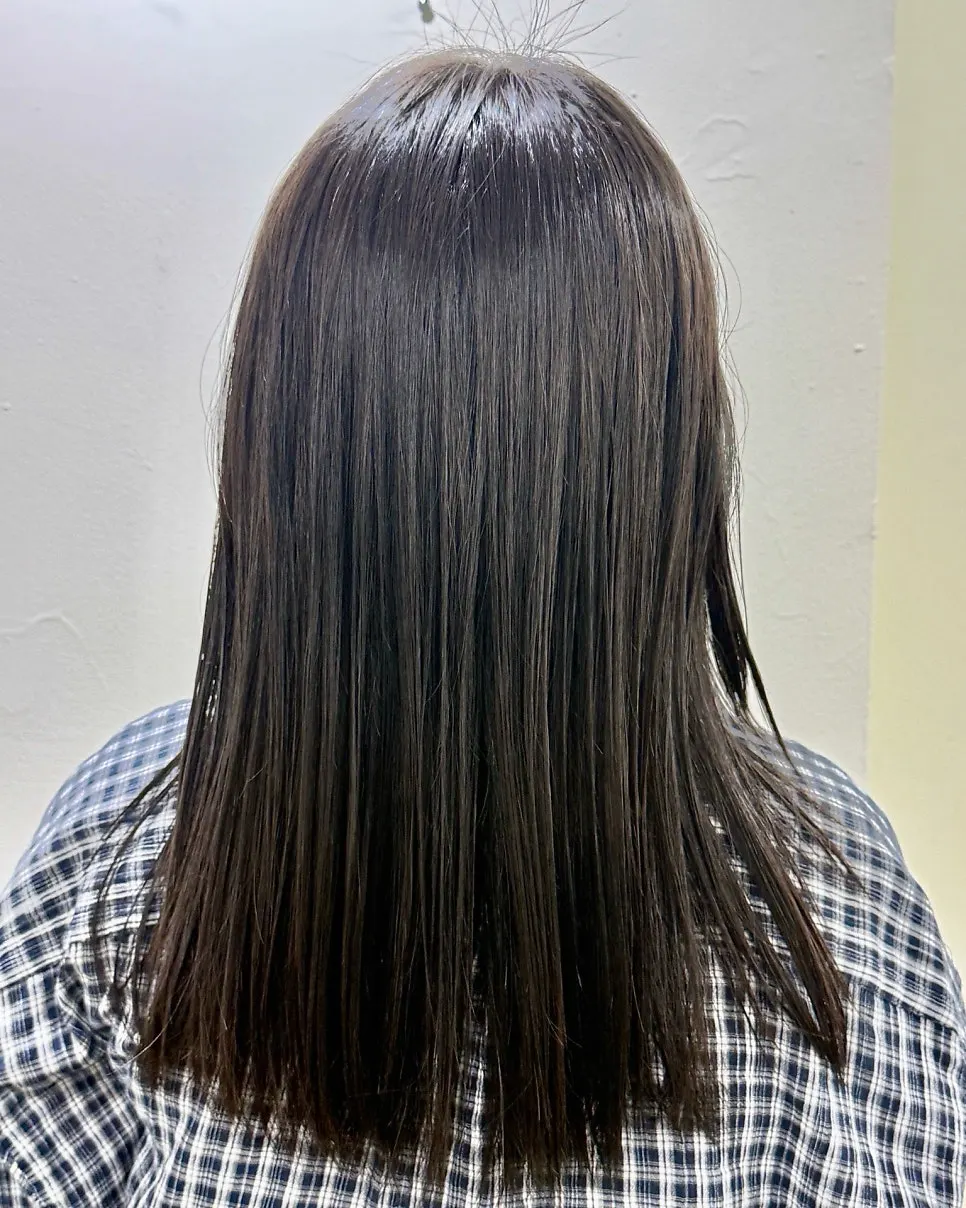 After photo showing calmer hair post-perm