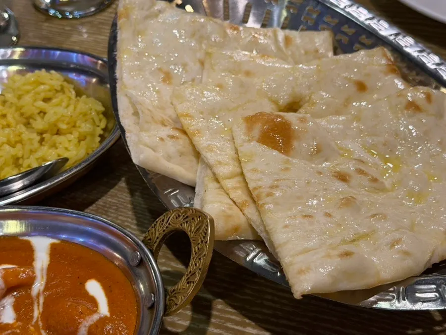 Hot garlic naan baked in a tandoor