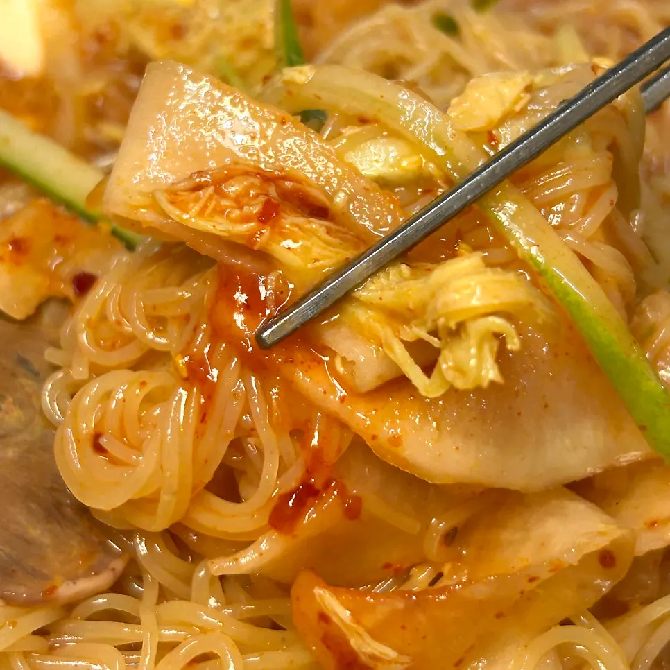Chopsticks lifting chogye bibim naengmyeon noodles