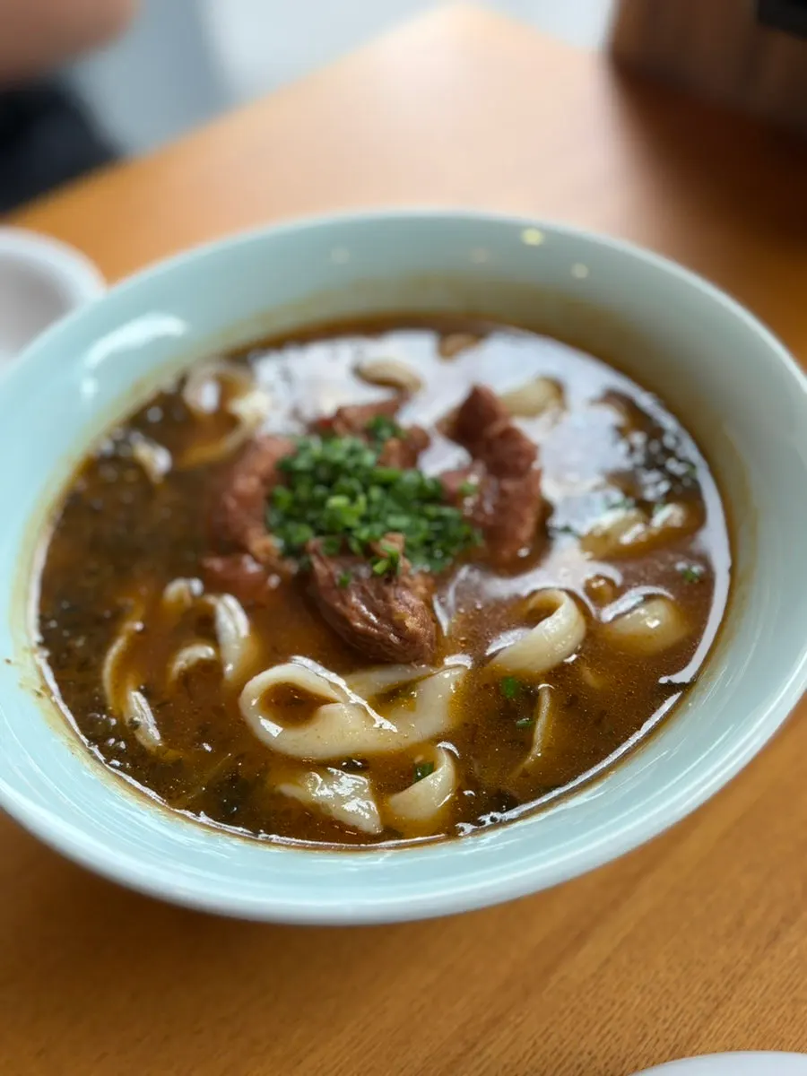 Cheonghwaweon's beef dao xiao mian with a rich broth