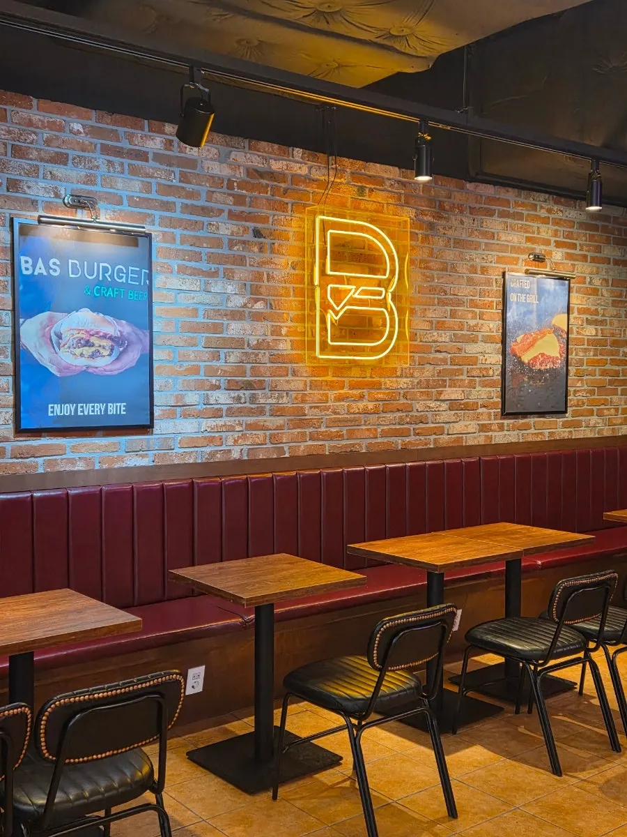 Bas Burger interior with neon signs