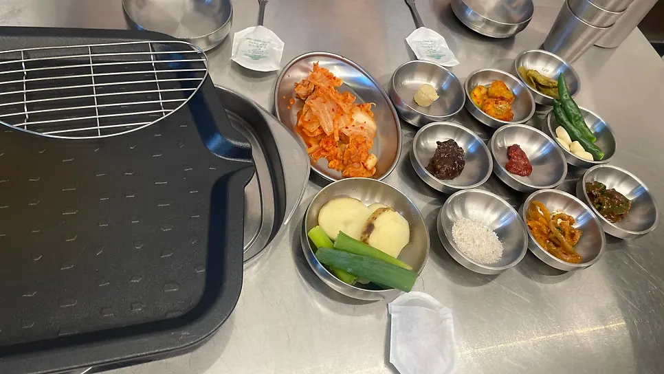 Full table of side dishes at Beefjeong, including Taebaek highland cabbage kimchi