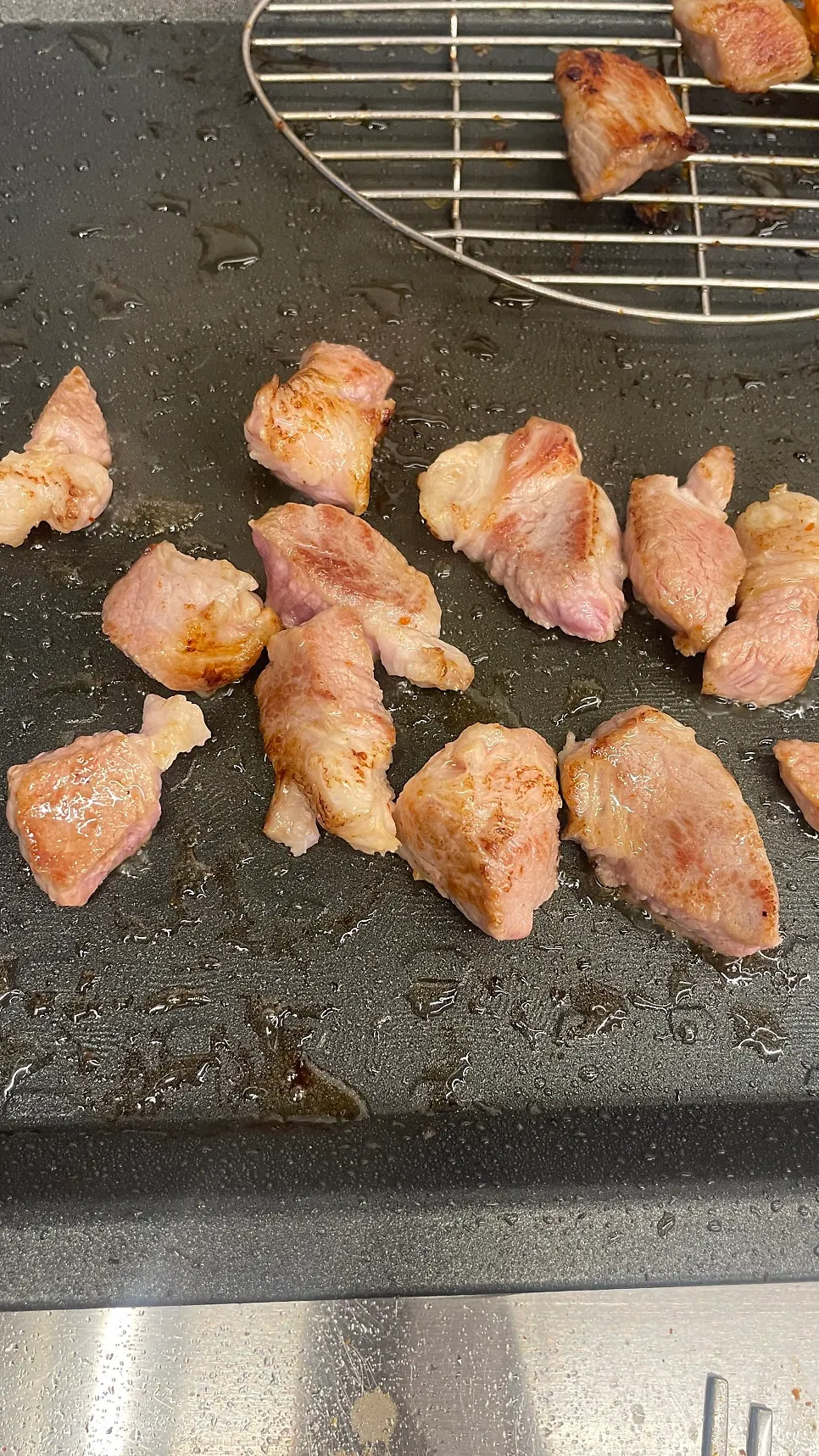 Jowl meat cooking on the grill