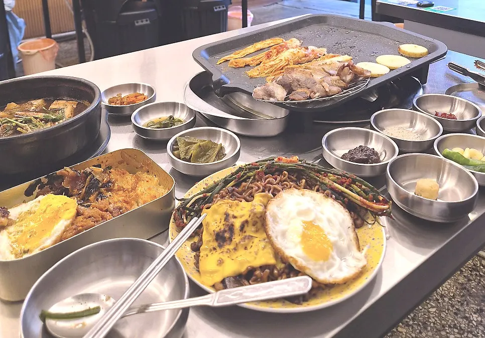 Table with pork belly and side dishes together