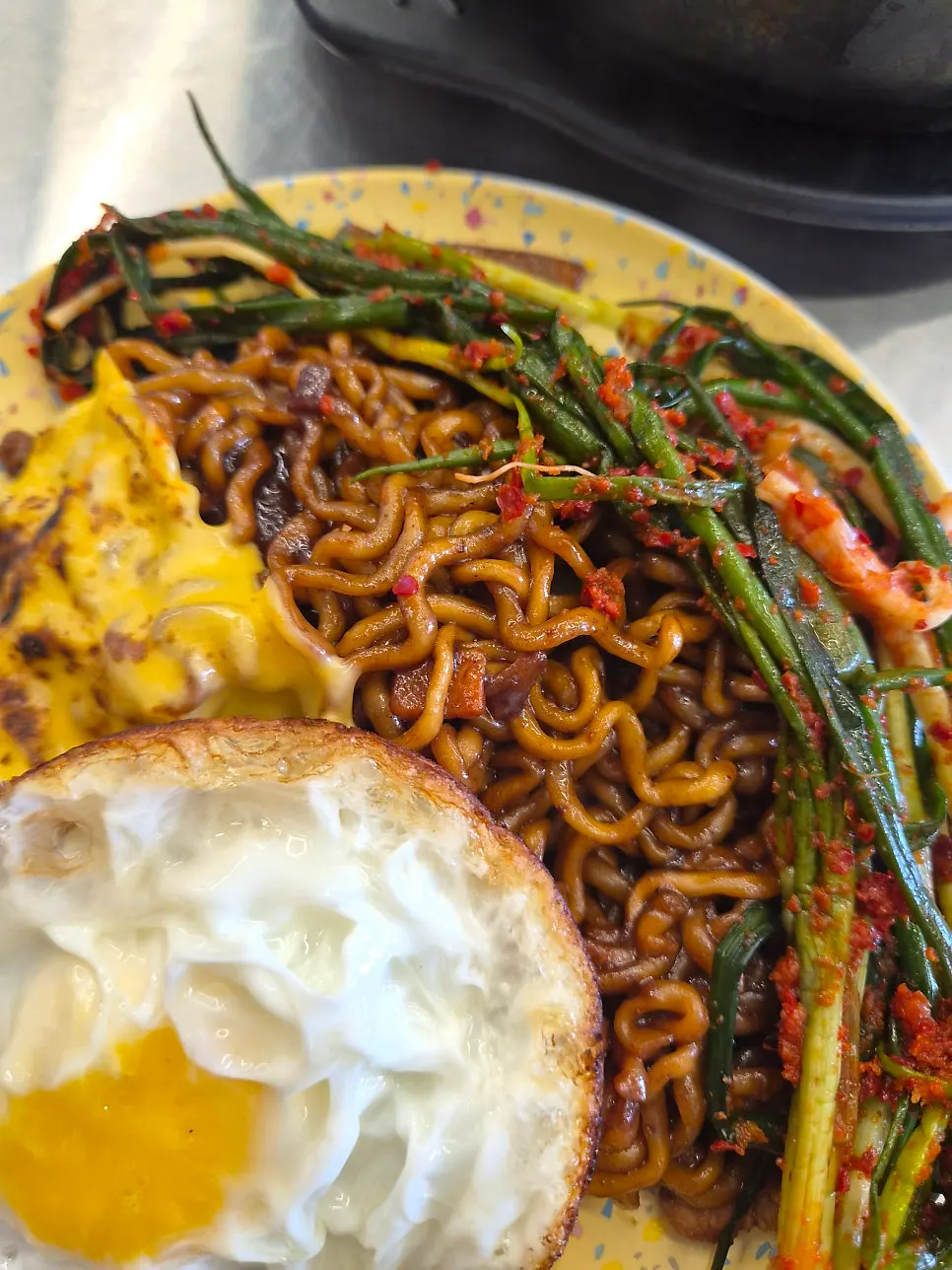 A bowl of jjagyechi with Irion green onion kimchi