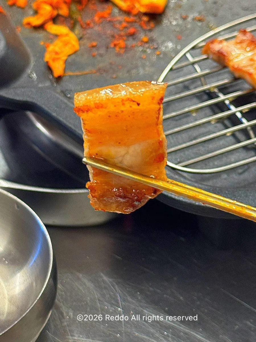 Pre-cut pork belly served at the table