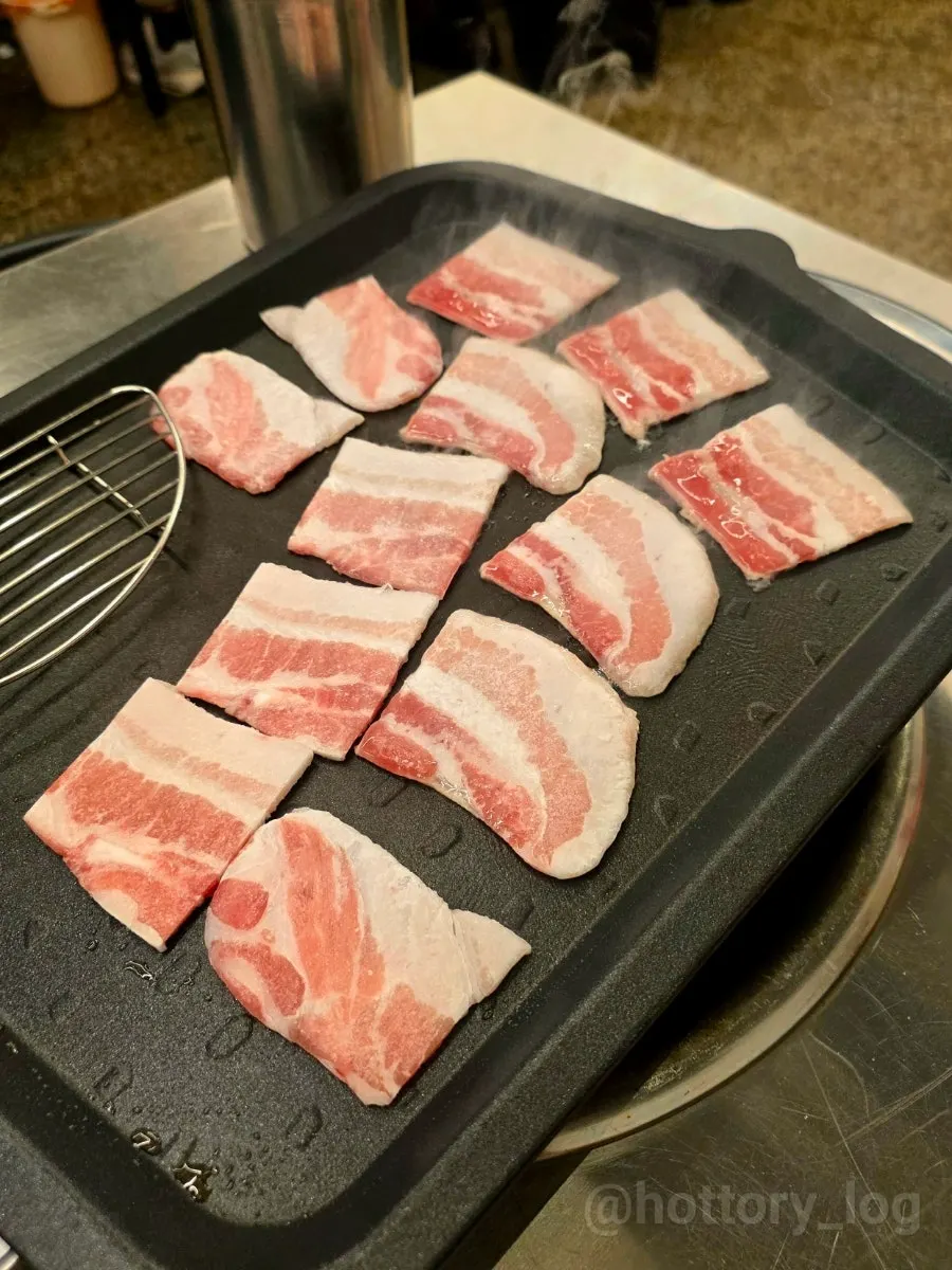Plate of raw frozen pork belly at Beefjeong